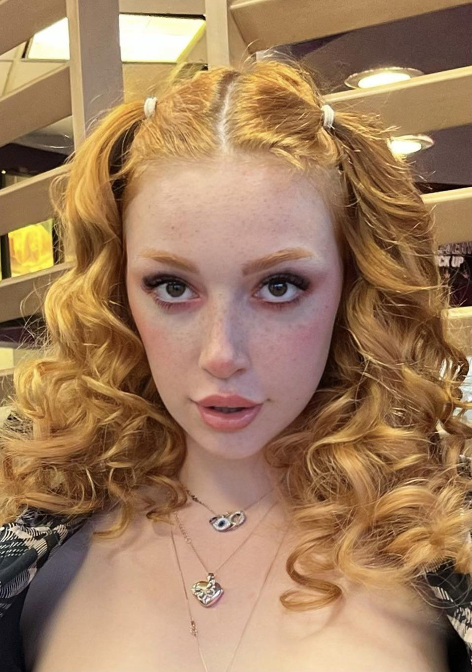 Fiery Beauty Flaunts Curves and Tempting Cleavage