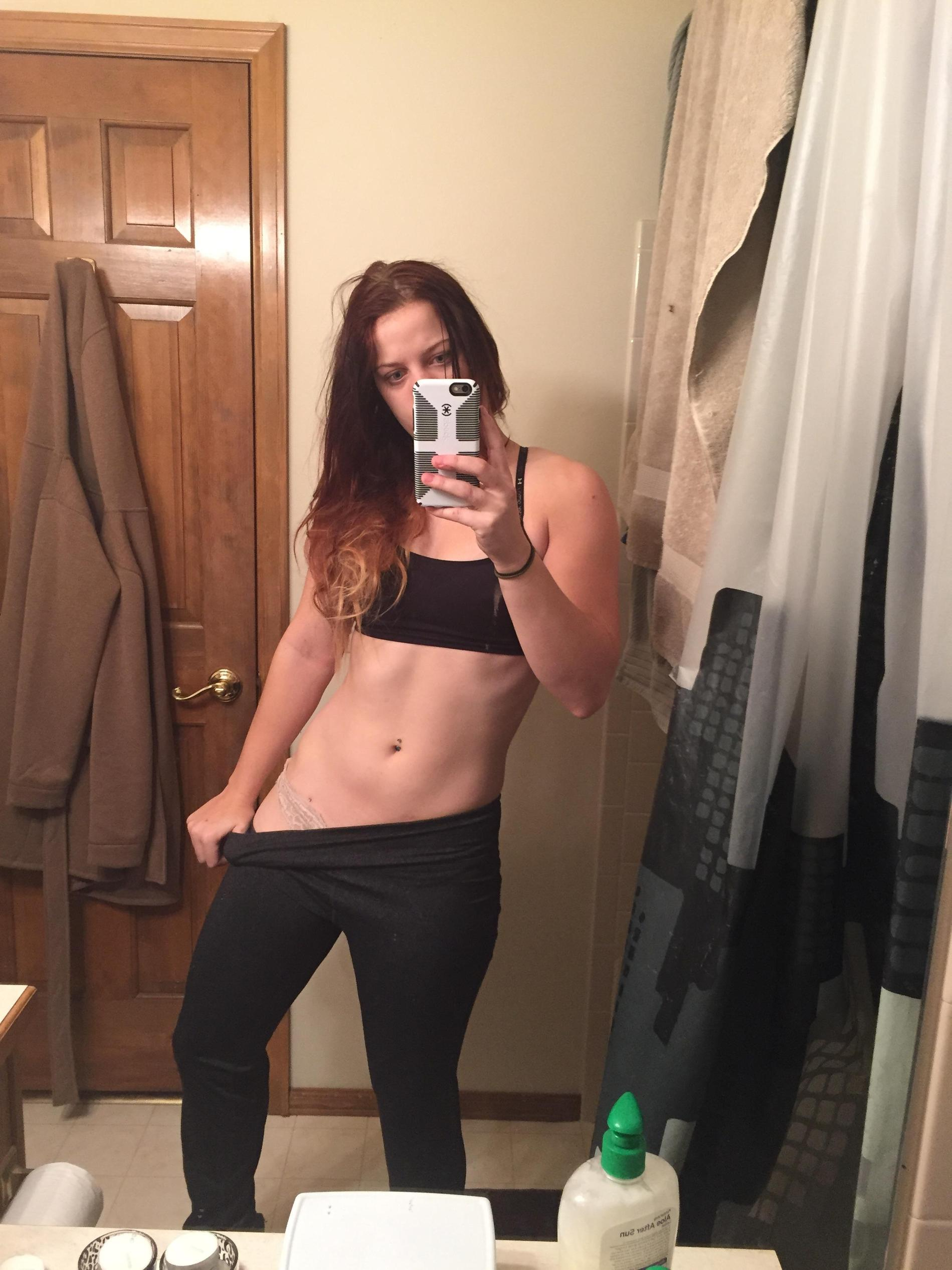 Sexy Girl Takes Selfie, Admiring Her Figure in Mirror