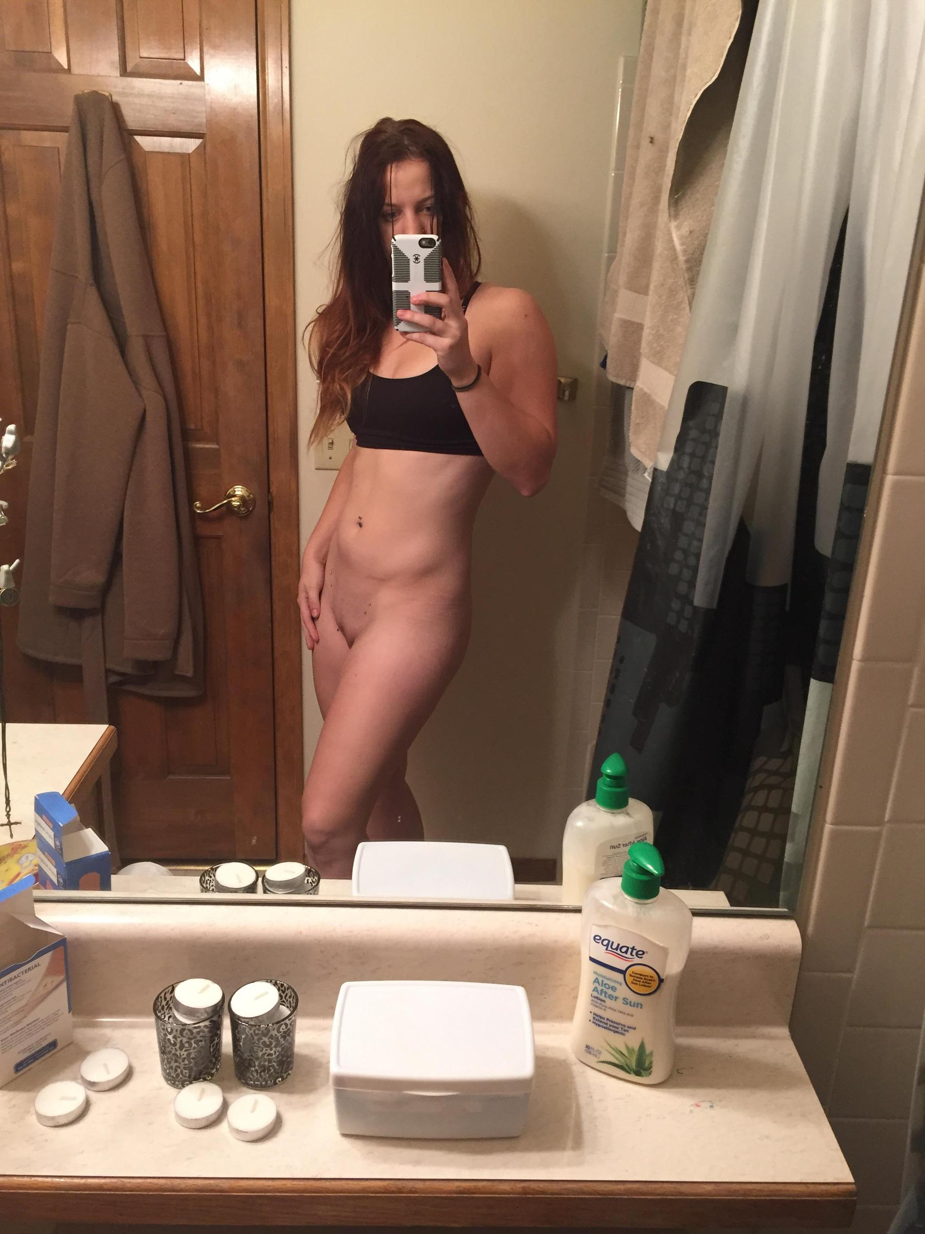 Sexy Girl Takes Selfie, Admiring Her Figure in Mirror
