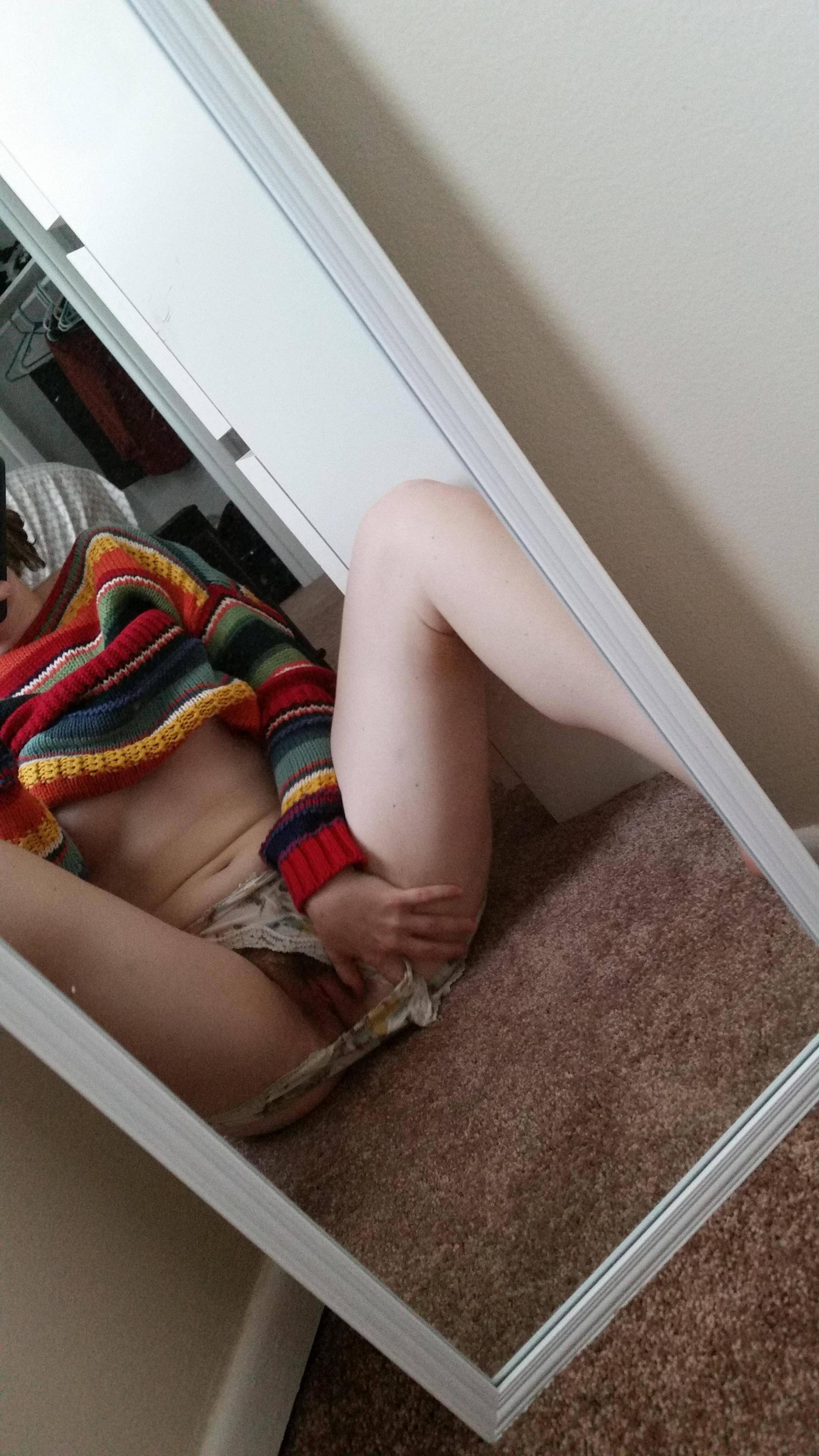 Girl with perfect body and natural private area takes selfie in front of mirror