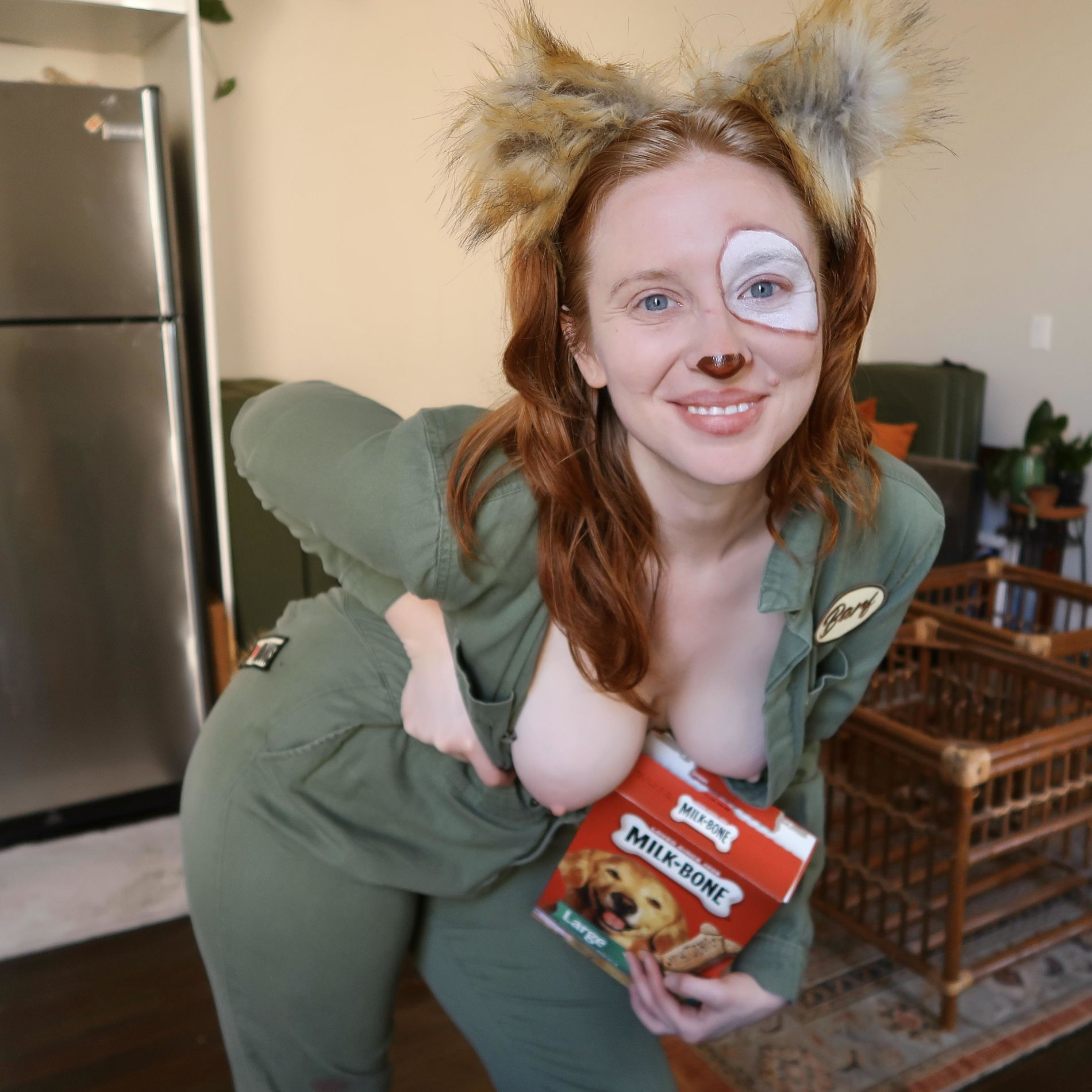 Seductive redhead girl flaunts her assets and naked body