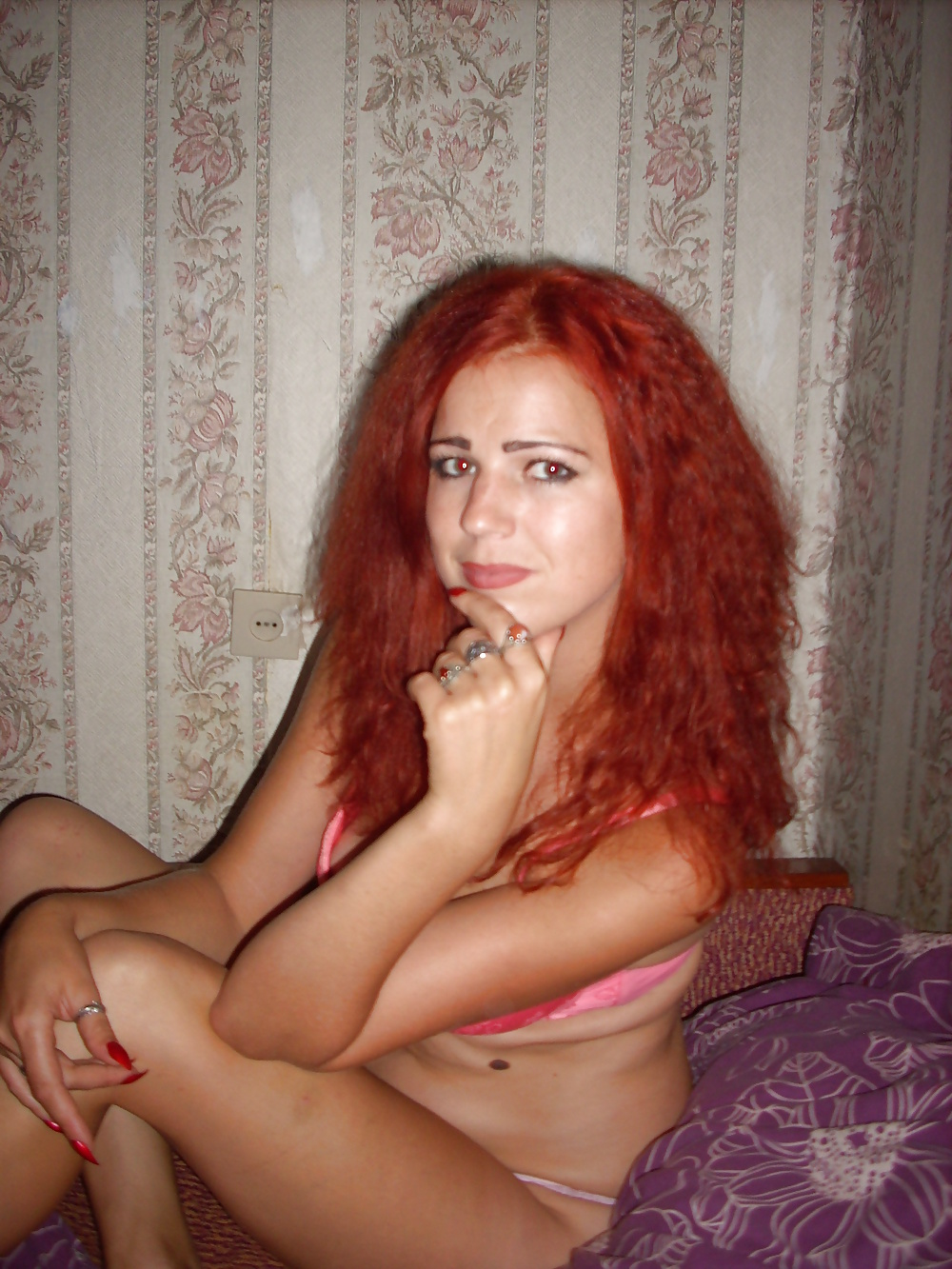 Seductive redhead woman flaunts her stunning body