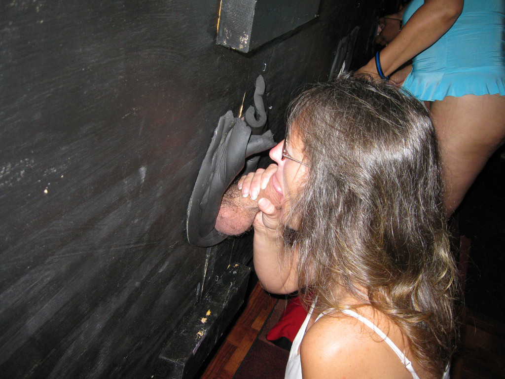 Mature Woman Gives Blowjob Through Gloryhole to Men in Cabin – photo 1