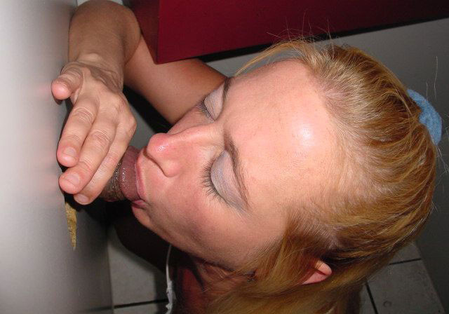 Horny woman gives blowjobs through gloryhole to multiple men