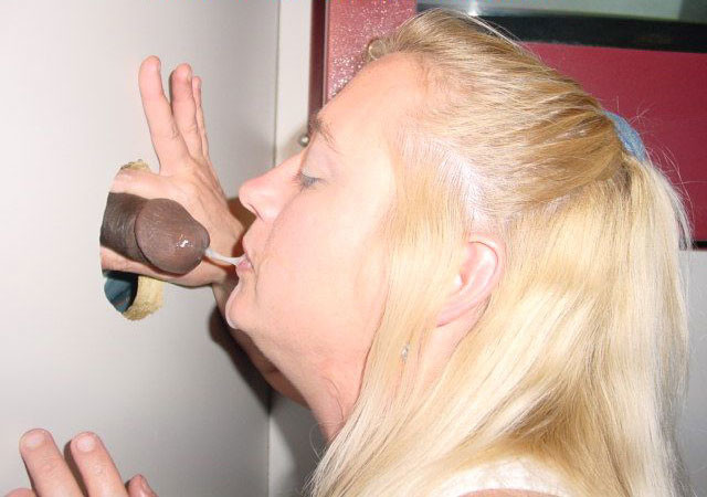 Horny woman gives blowjobs through gloryhole to multiple men