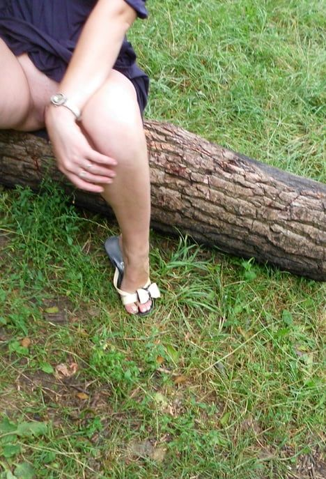 Seductive Maiden Poses by Lake in Forest Clearing