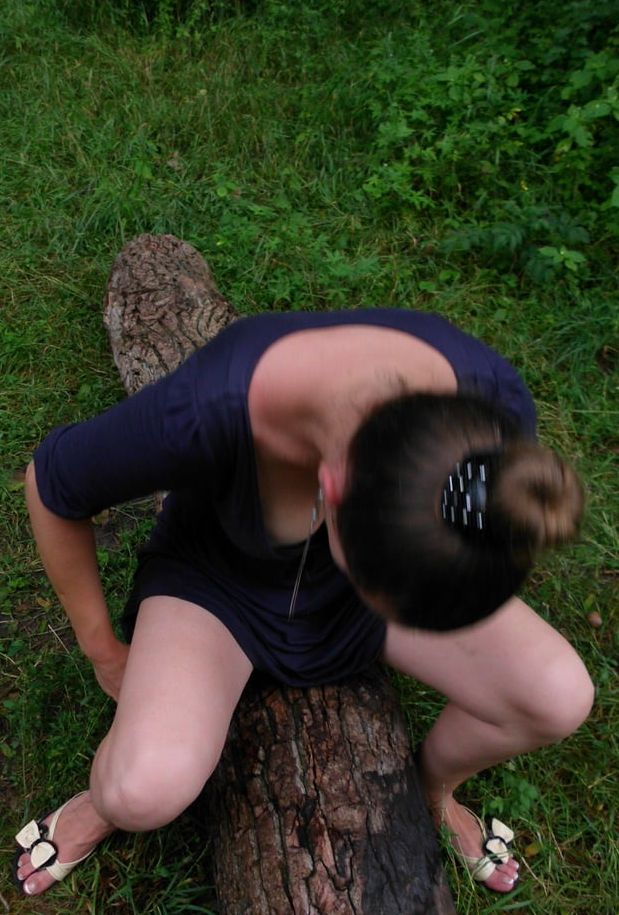 Seductive Maiden Poses by Lake in Forest Clearing