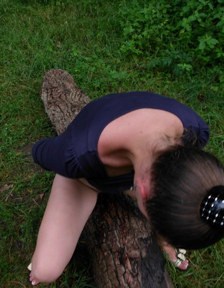 Seductive Maiden Poses by Lake in Forest Clearing