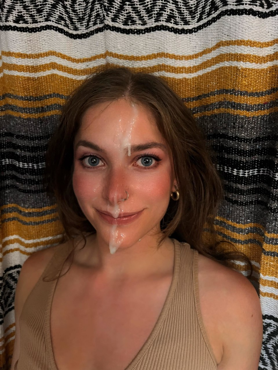 Hot babe loves posing with cum on her face after getting a facial