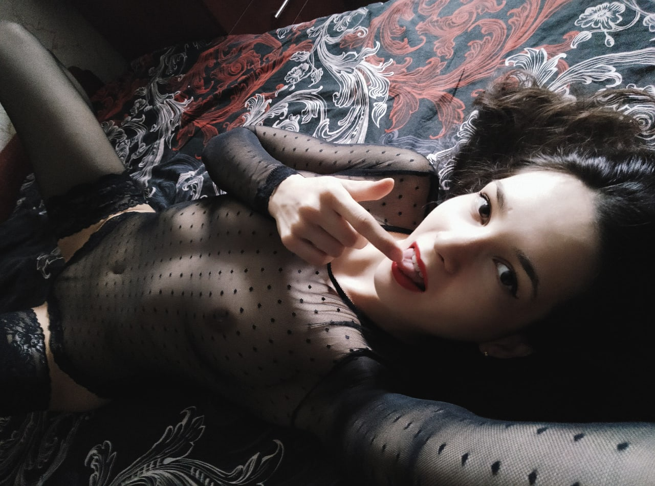 Seductive Brunette with Perfect Curves Poses Confidently