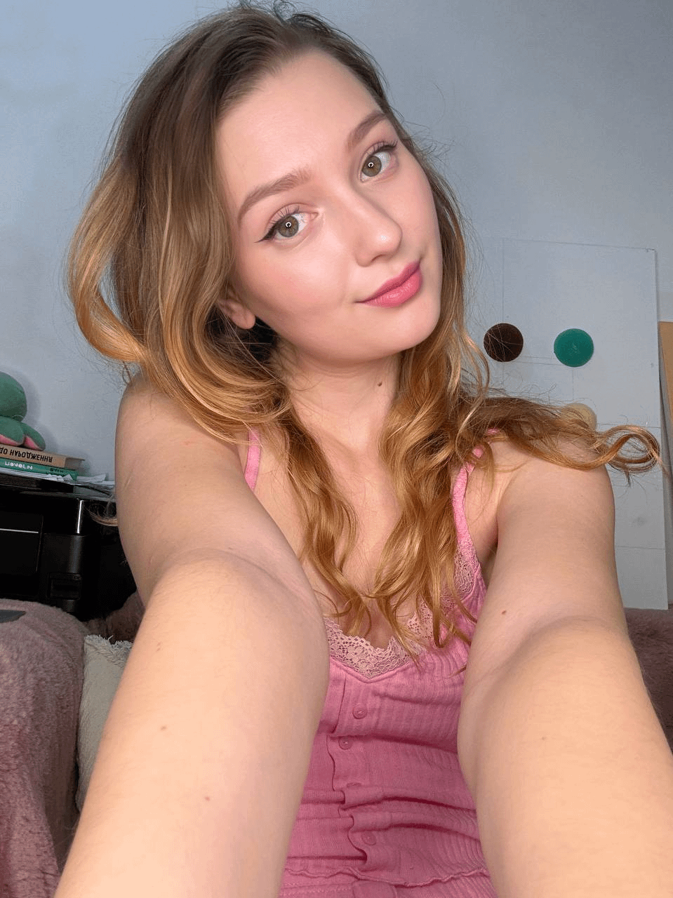 Young girl spreading legs to show holes in explicit pose – photo 1