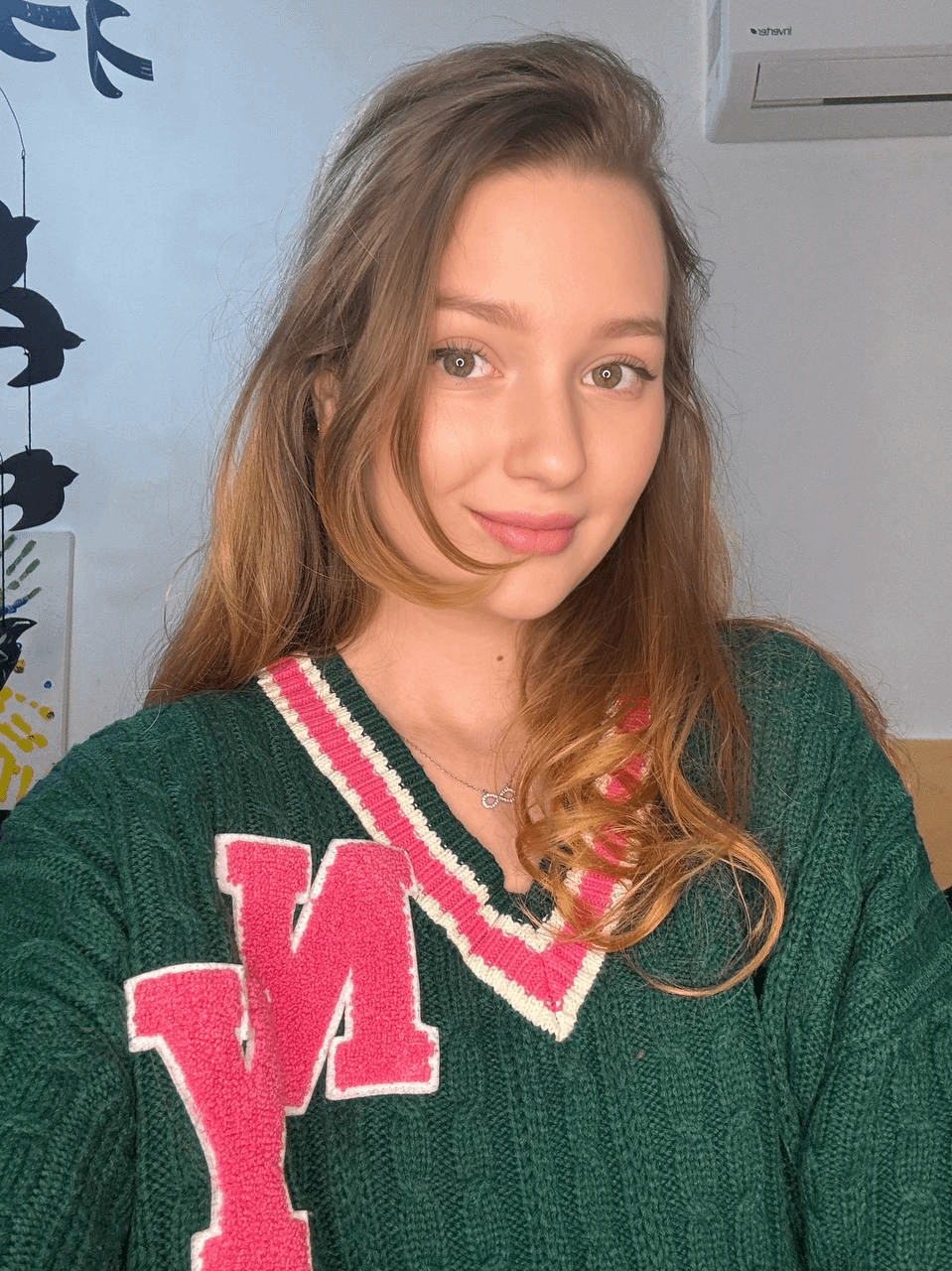 Young girl spreading legs to show holes in explicit pose