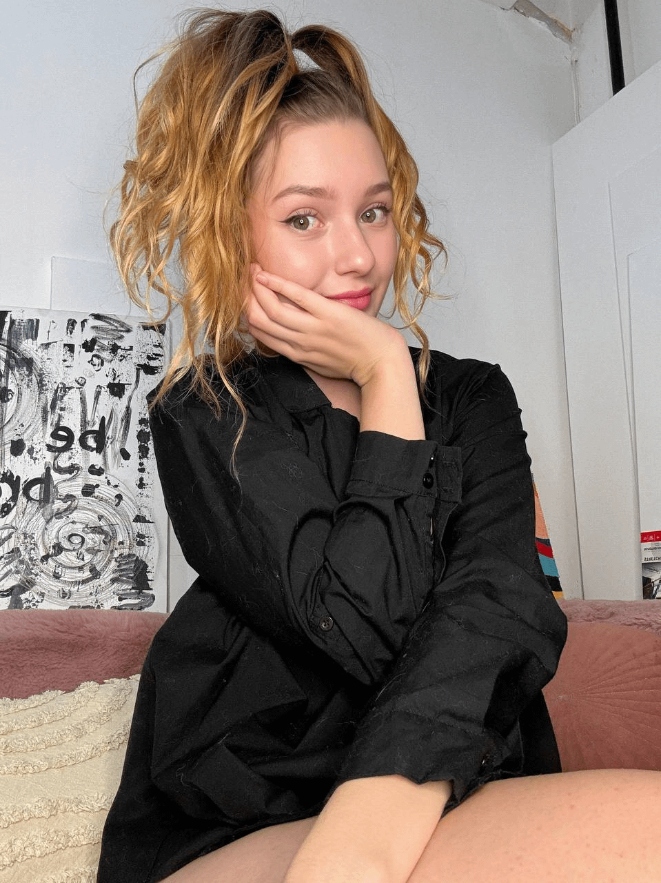 Young girl spreading legs to show holes in explicit pose