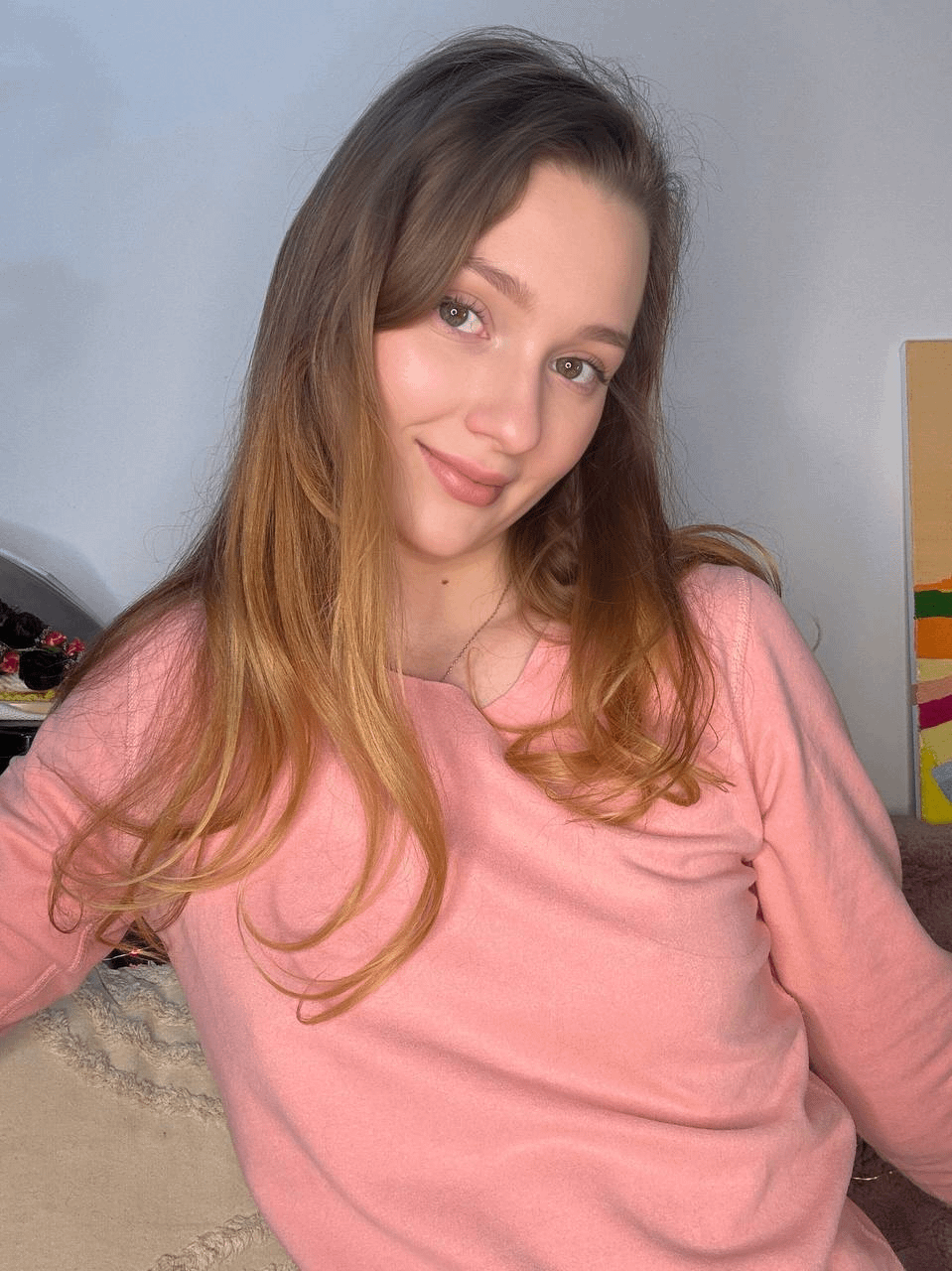 Young girl spreading legs to show holes in explicit pose