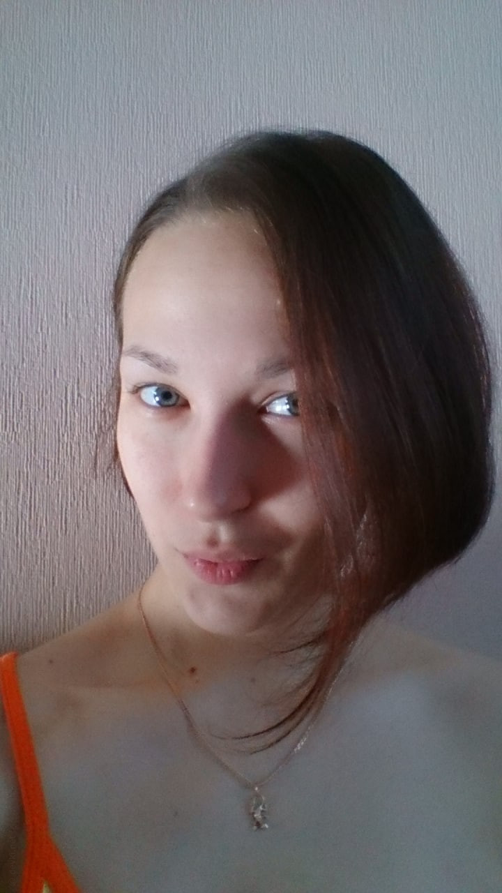 Naked Girl Takes Explicit Selfie, Revealing Intimate Body Parts in Cozy Setting