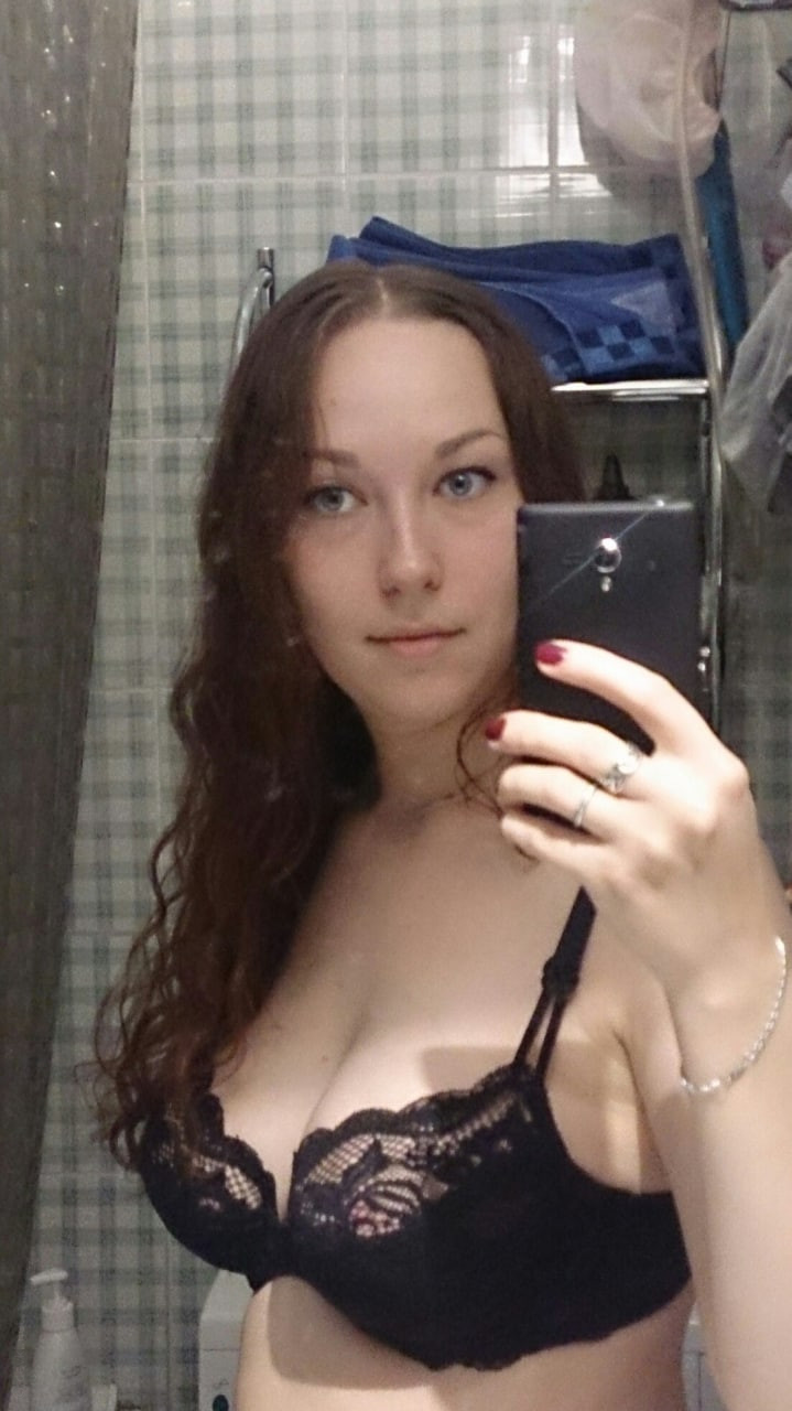 Naked Girl Takes Explicit Selfie, Revealing Intimate Body Parts in Cozy Setting