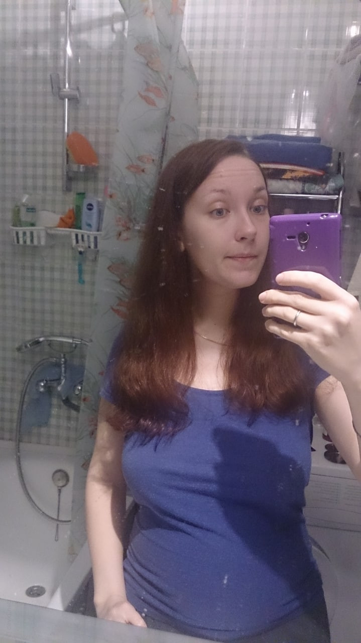 Naked Girl Takes Explicit Selfie, Revealing Intimate Body Parts in Cozy Setting