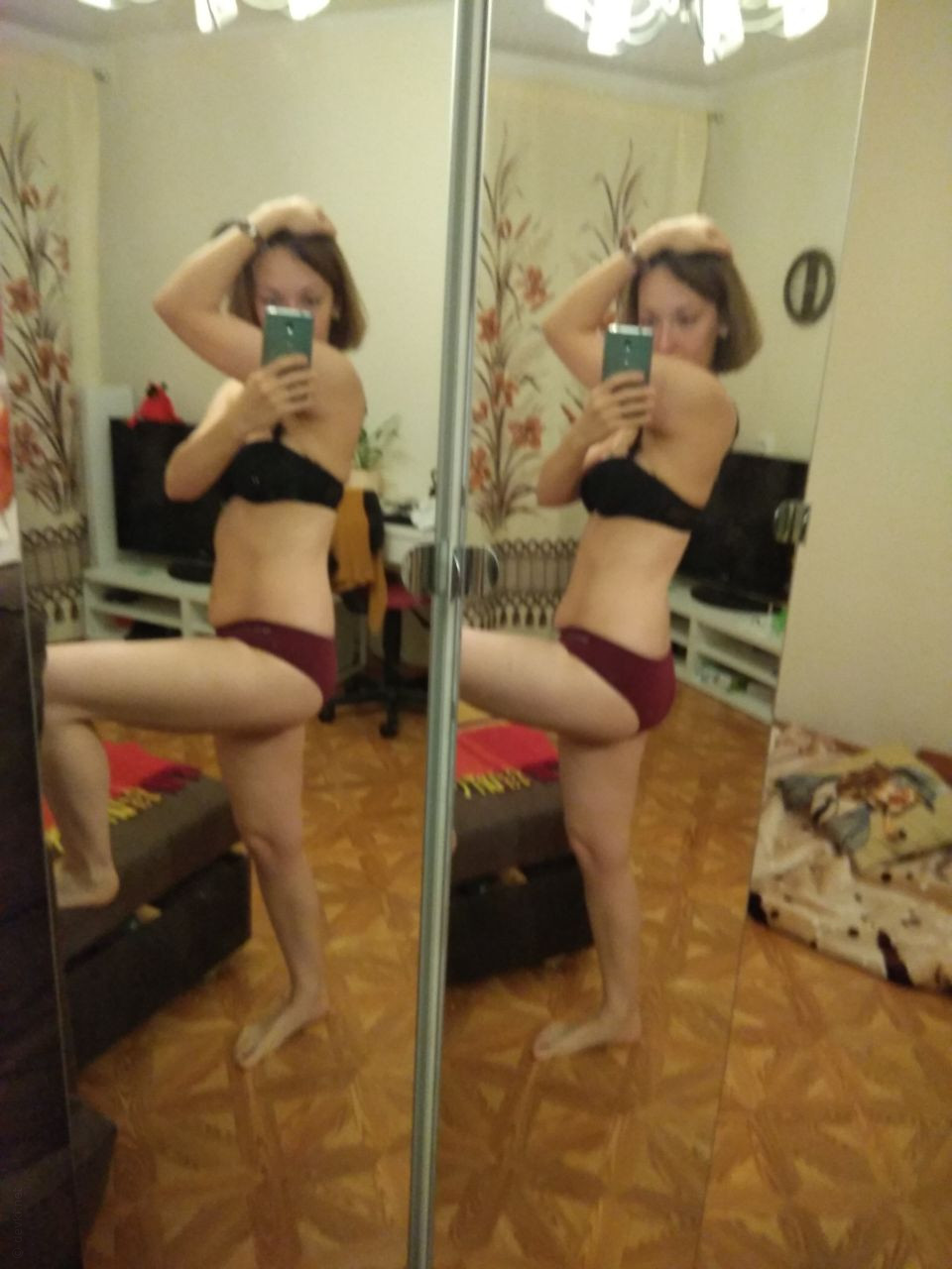 Naked Girl Takes Explicit Selfie, Revealing Intimate Body Parts in Cozy Setting