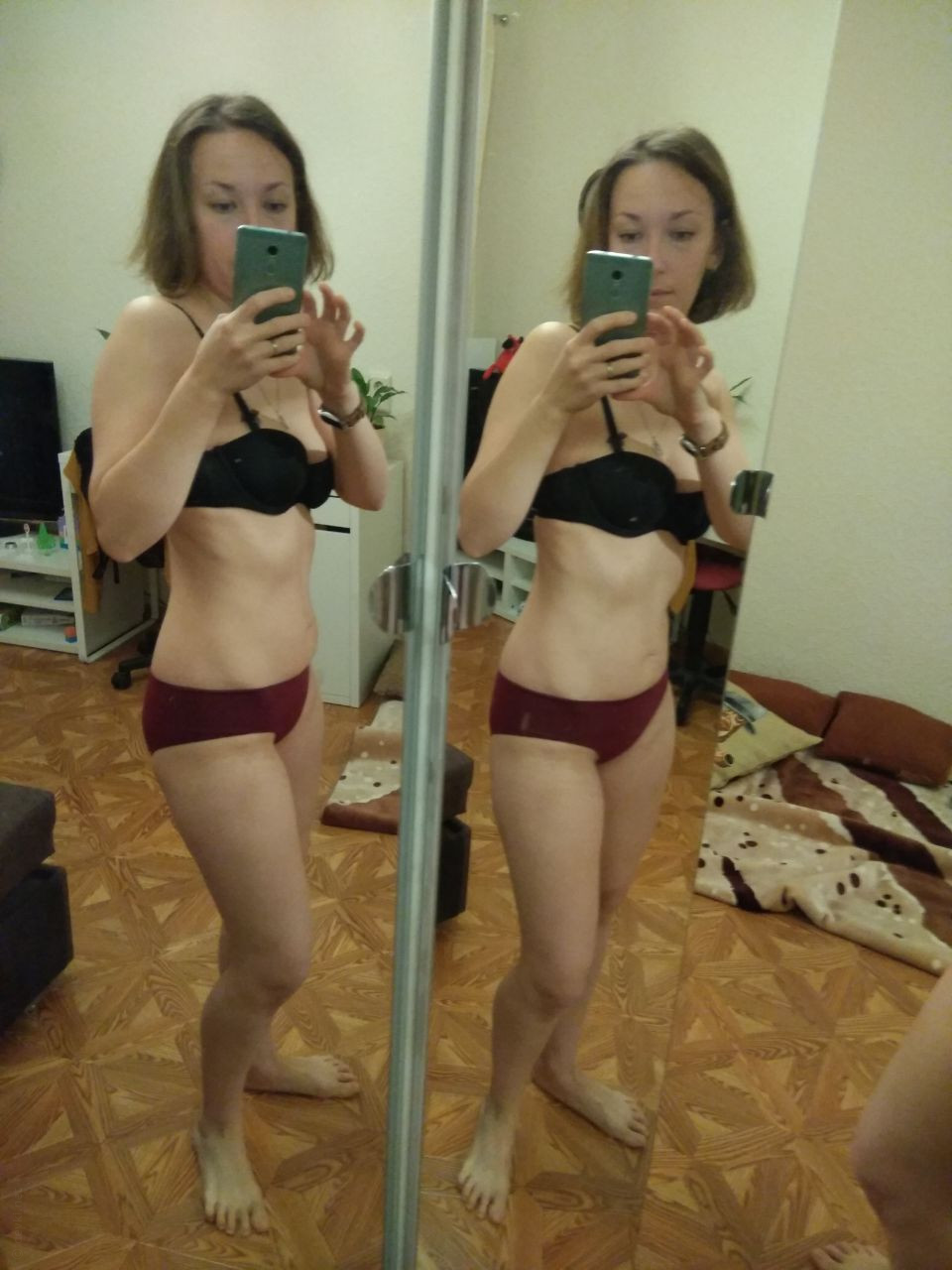 Naked Girl Takes Explicit Selfie, Revealing Intimate Body Parts in Cozy Setting