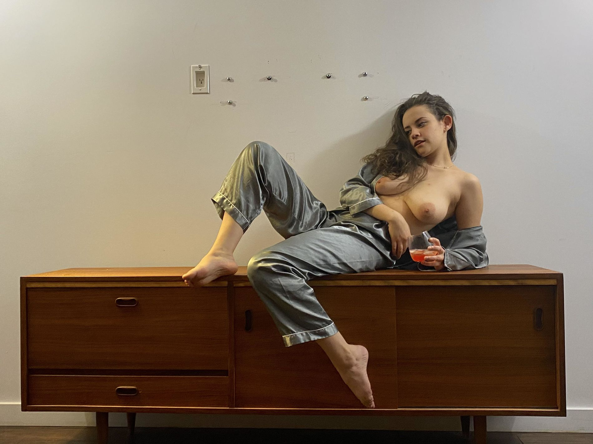 Playful busty babe with hairy pussy shows off in various outfits and naked