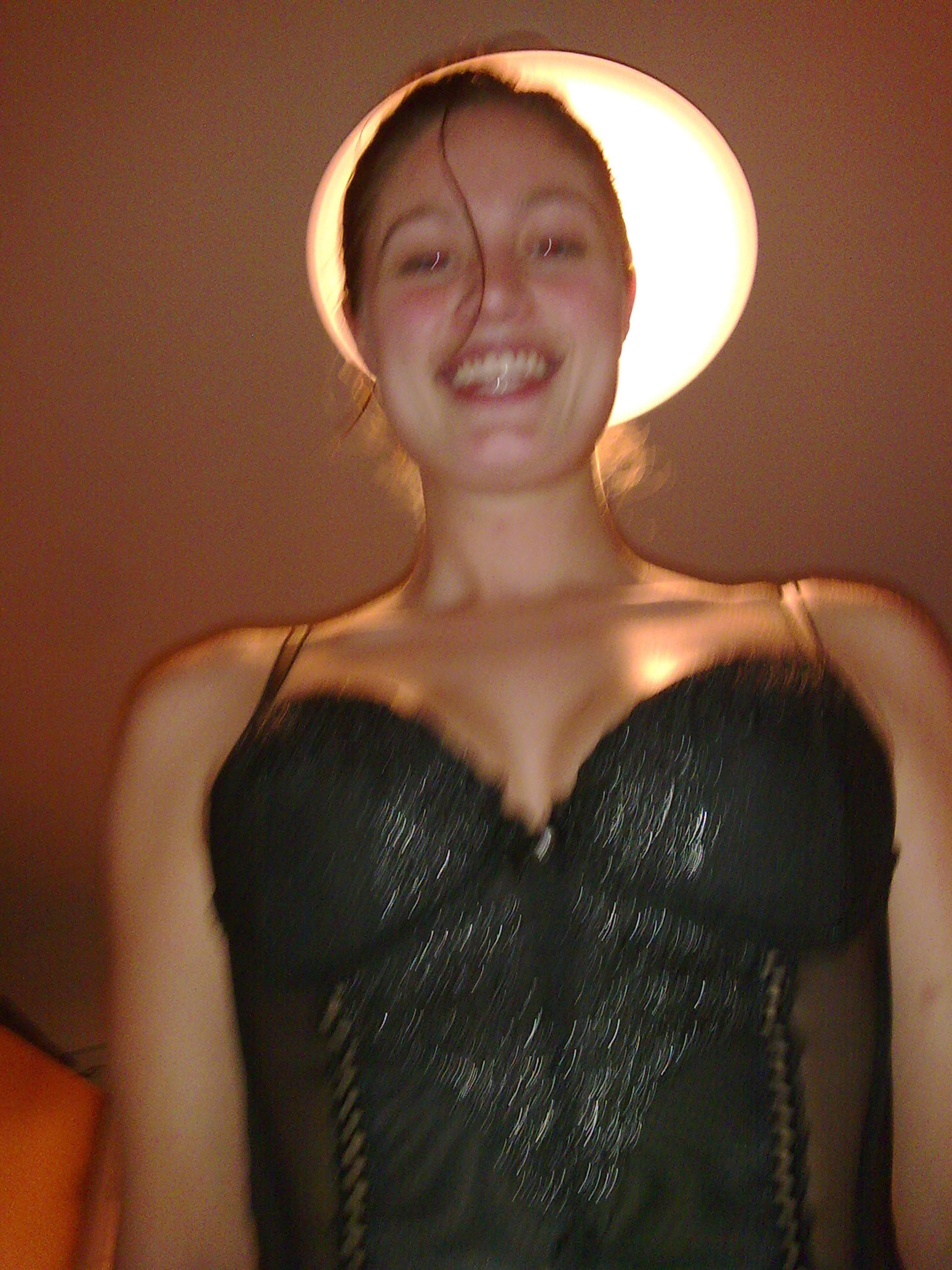 Sensual girl posing nude in hotel room during vacation