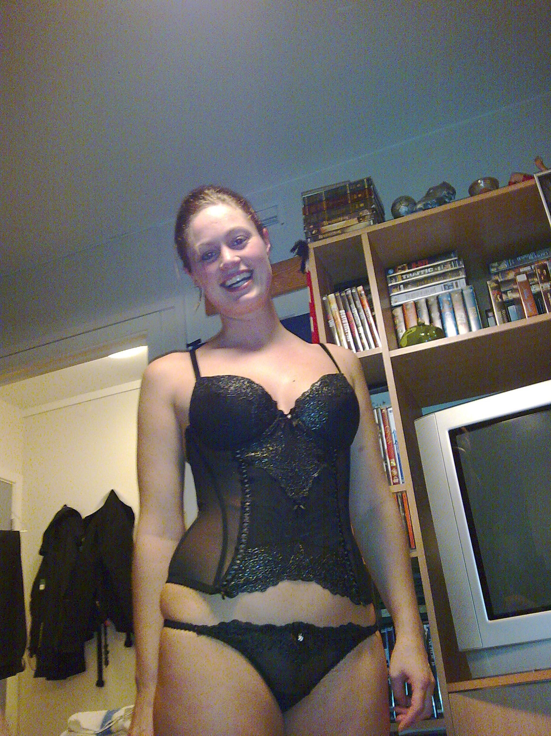 Sensual girl posing nude in hotel room during vacation