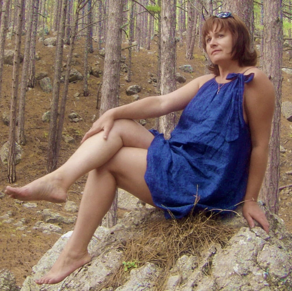 Hot mature woman looks incredibly sexy in the forest outdoors