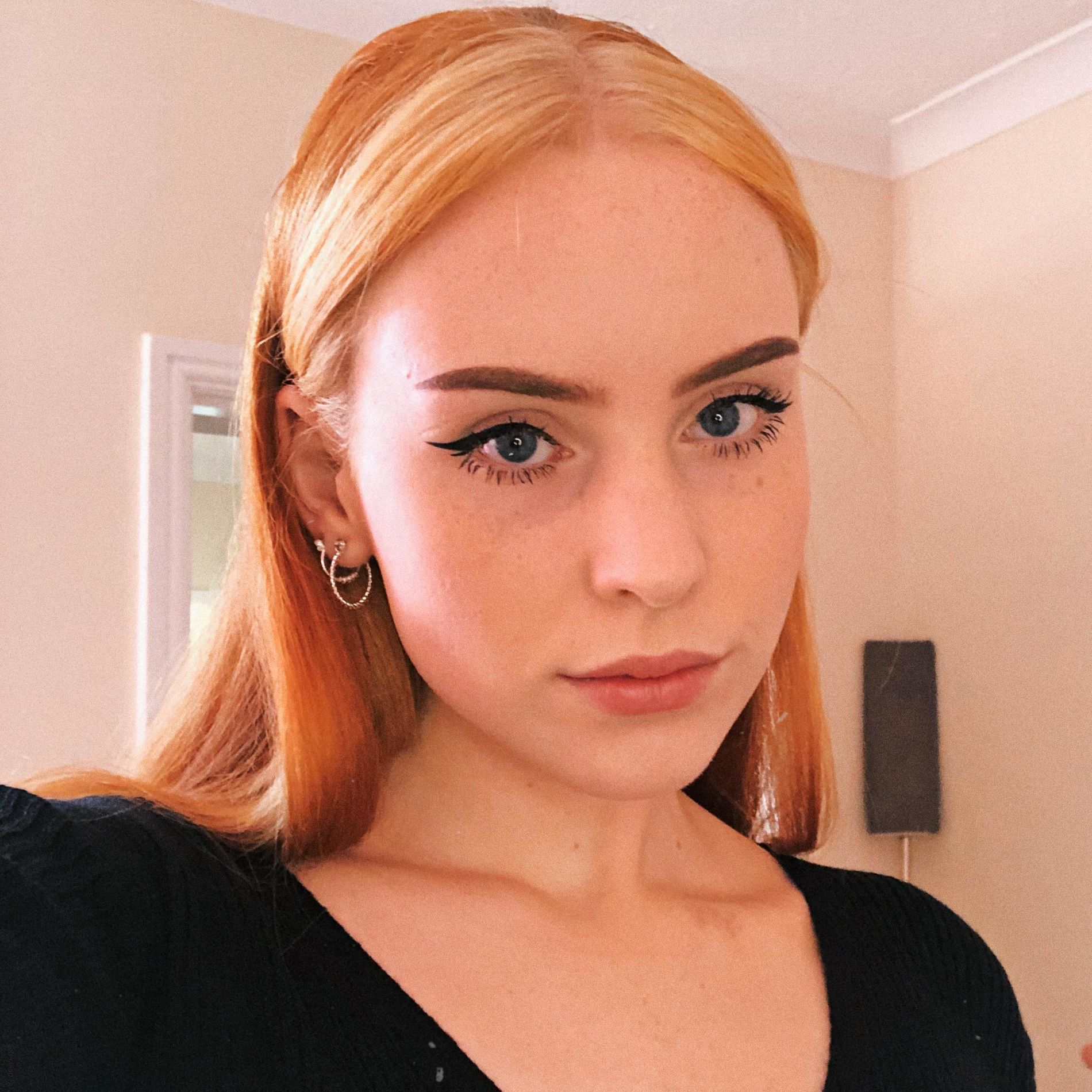 Seductive Redhead Takes Provocative Selfies at Home