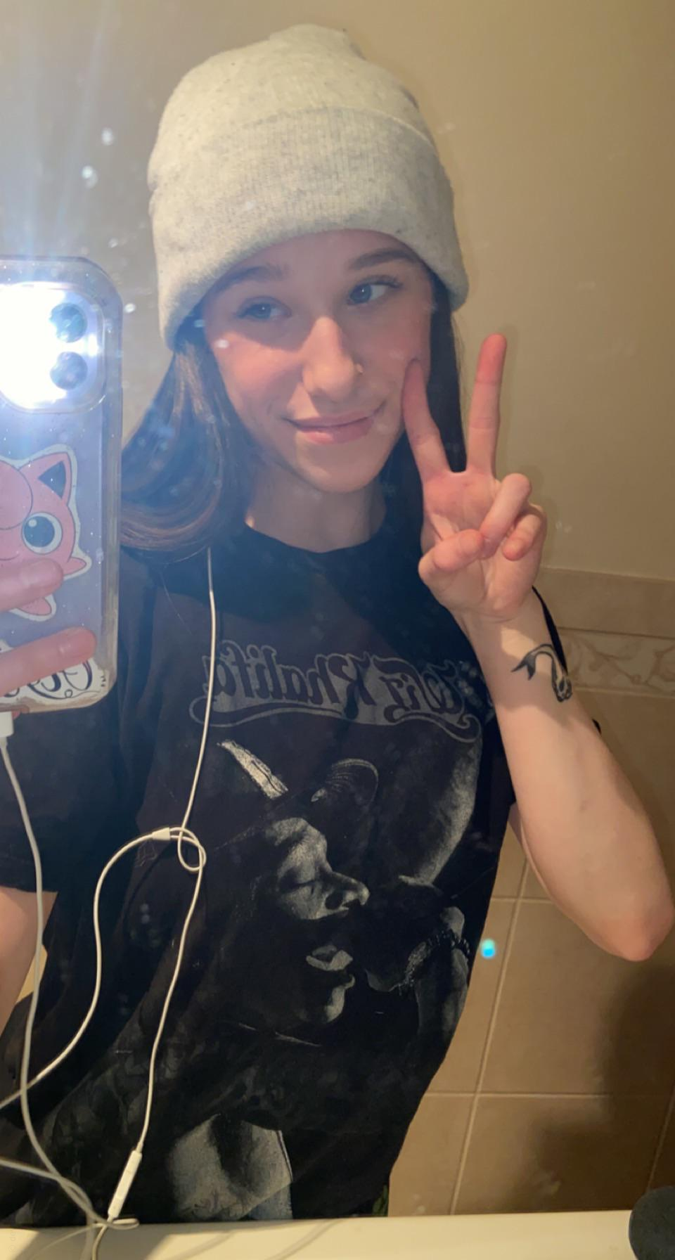 Skinny girl shows off her fluffy pussy in explicit photo session.