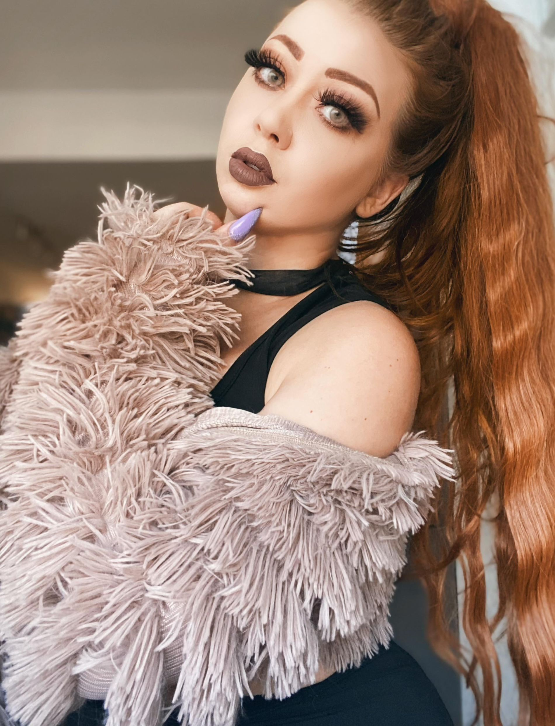 Redhead girl flaunts smooth-shaven intimate area and alluring breasts in selfie.