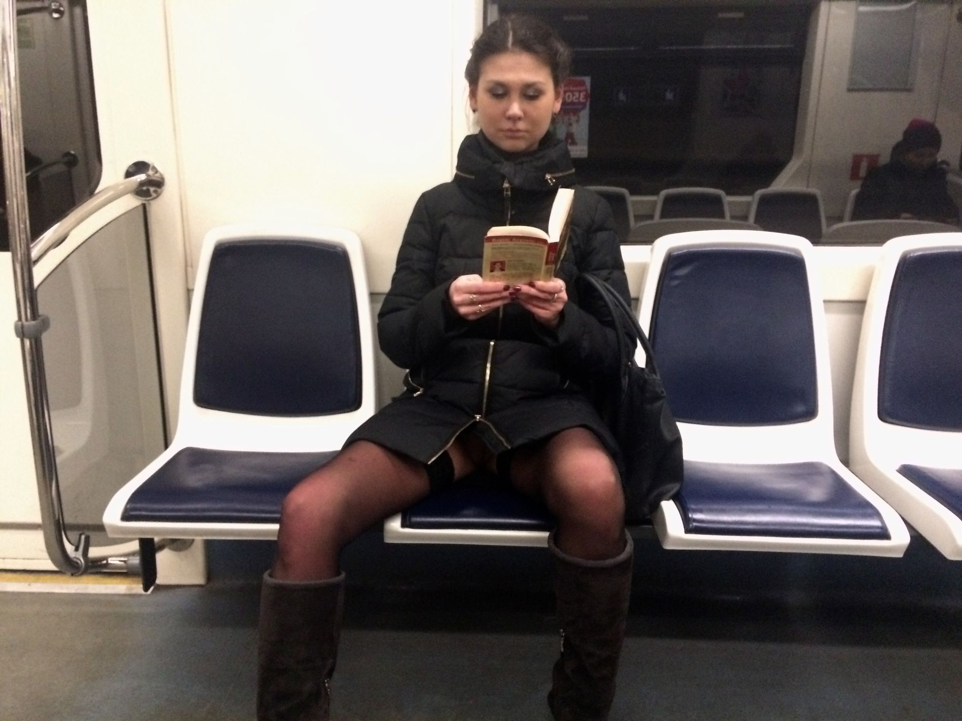 Woman in public transport without underwear, in black stockings, spreading legs, showing intimate area – photo 1