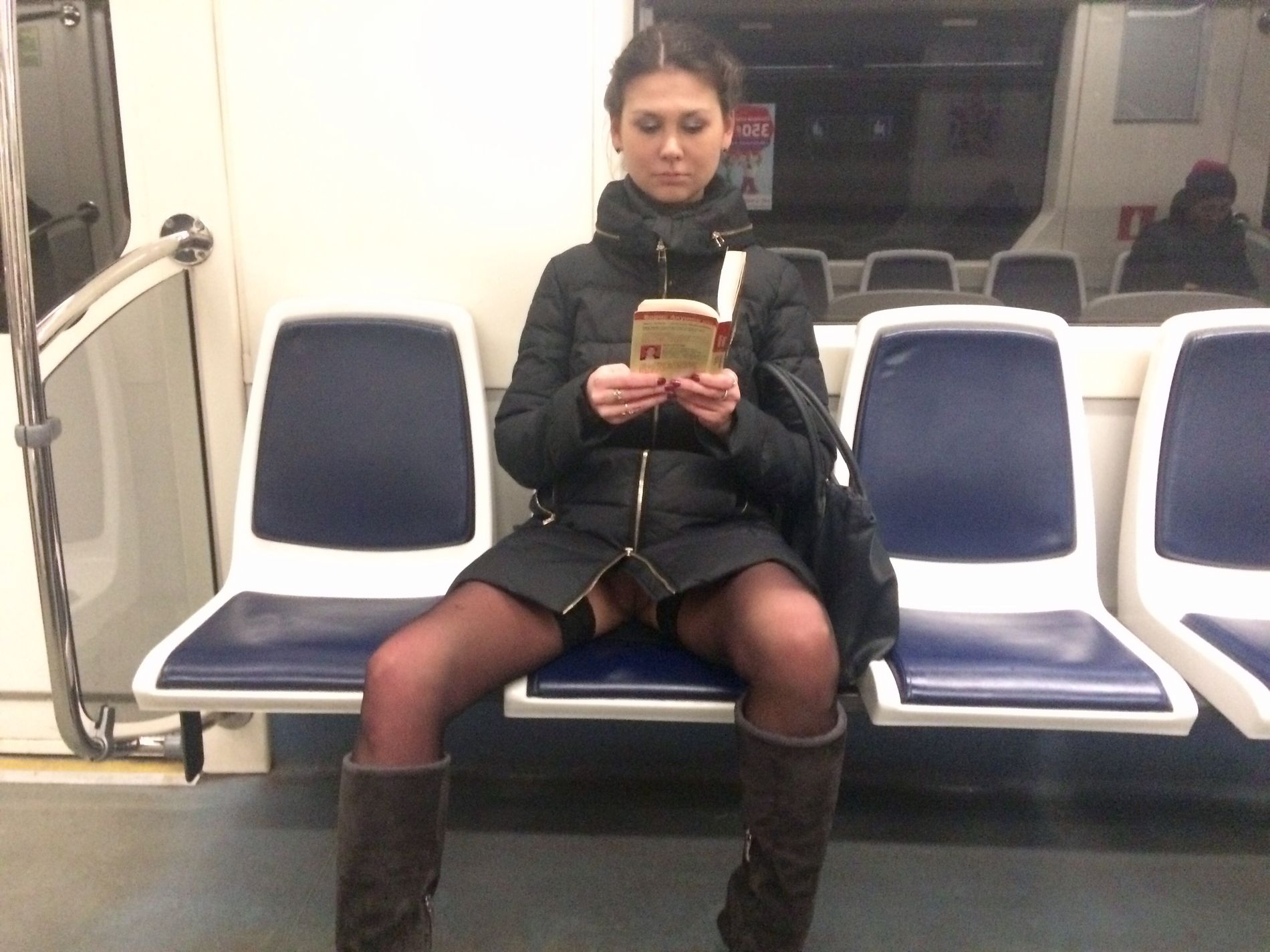 Woman in public transport without underwear, in black stockings, spreading legs, showing intimate area