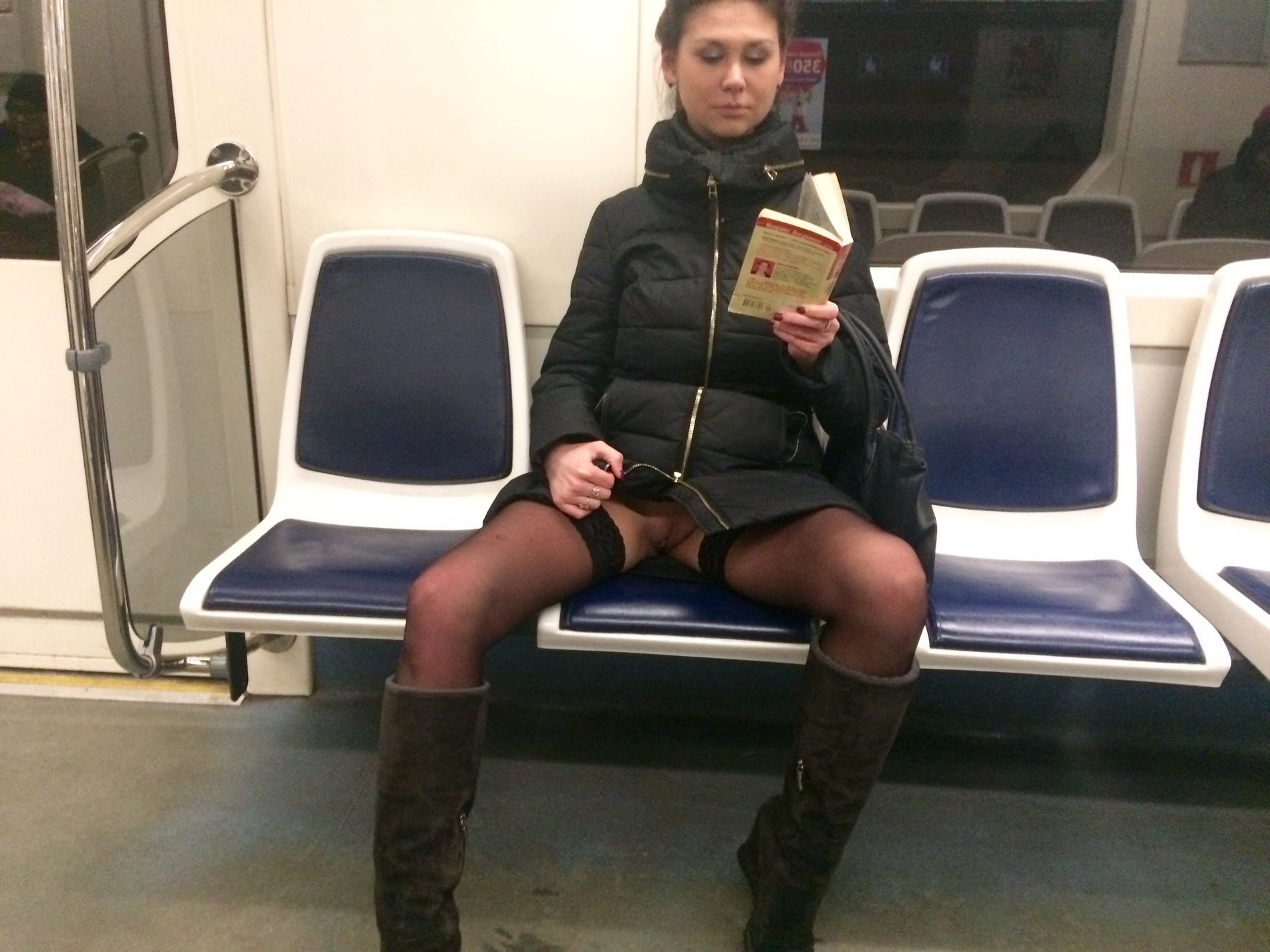 Woman in public transport without underwear, in black stockings, spreading legs, showing intimate area