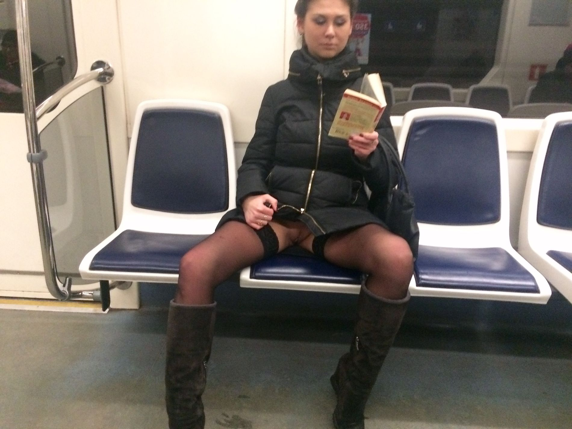 Woman in public transport without underwear, in black stockings, spreading legs, showing intimate area