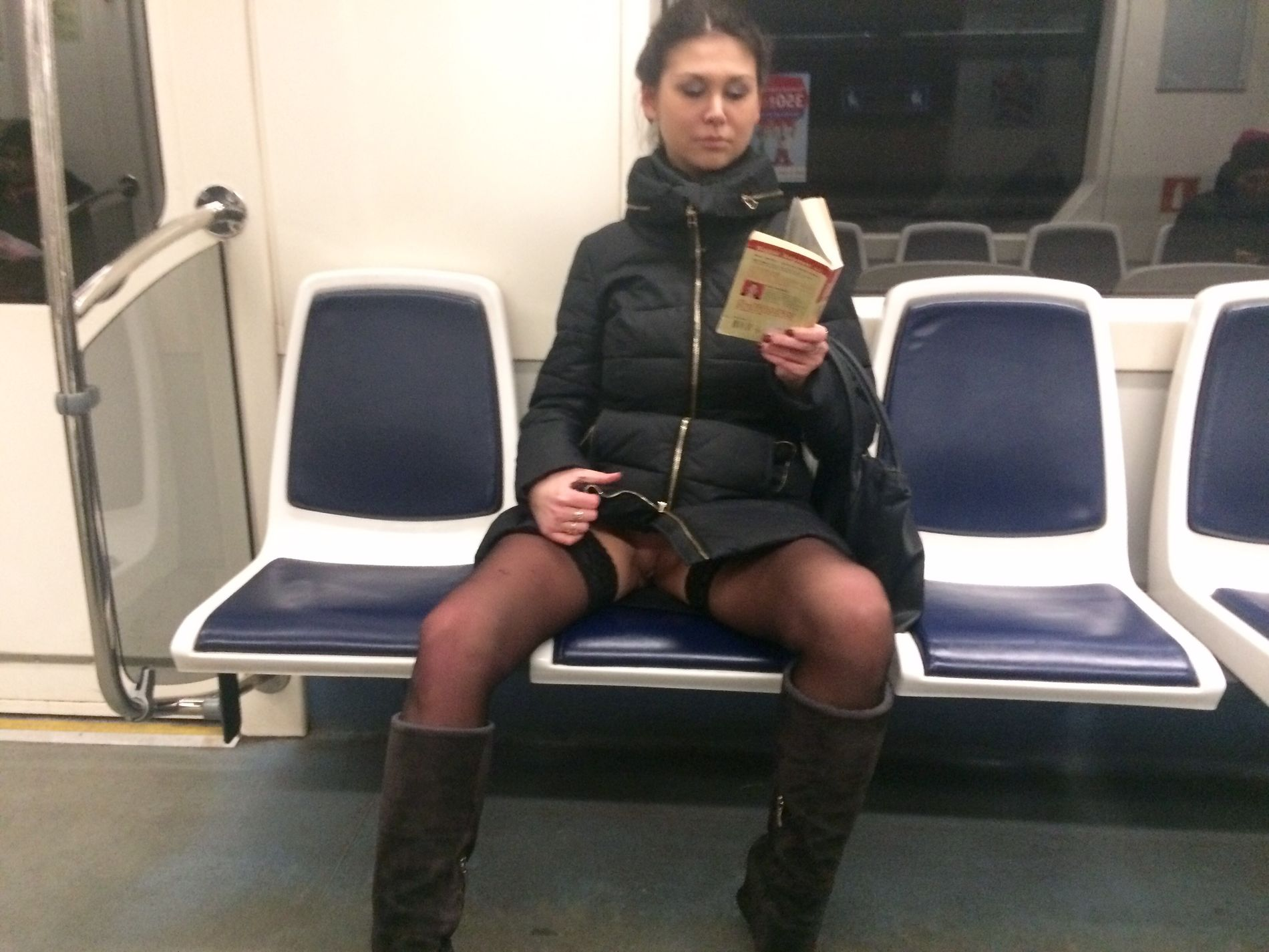 Woman in public transport without underwear, in black stockings, spreading legs, showing intimate area