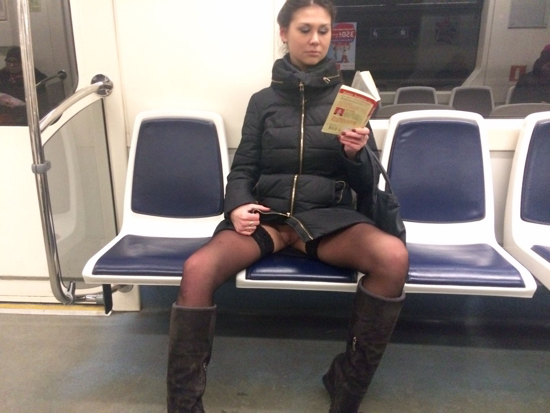 Woman in public transport without underwear, in black stockings, spreading legs, showing intimate area