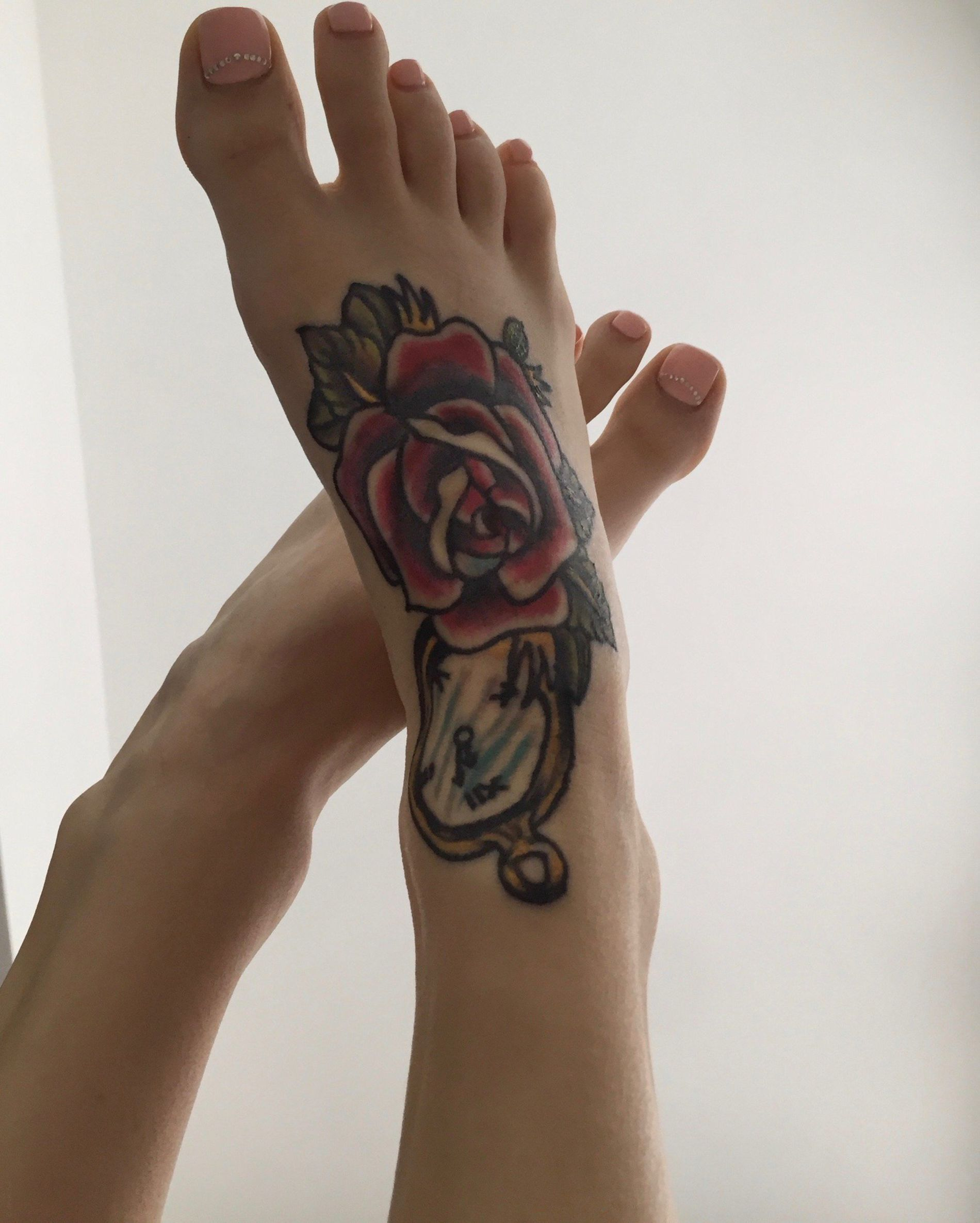 Young girl with tattoos having sex and showing intimate parts in porn photos