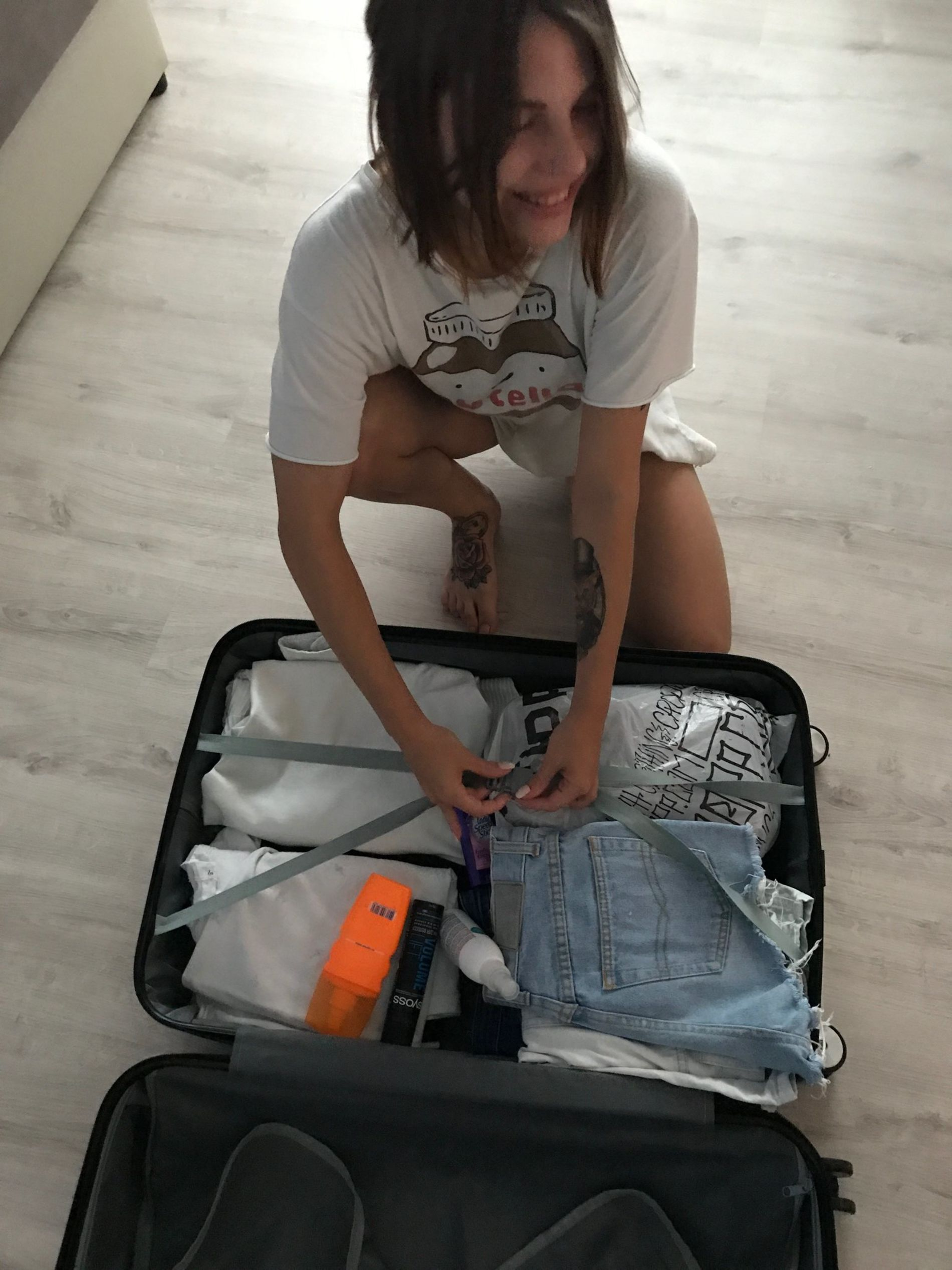 Young girl with tattoos having sex and showing intimate parts in porn photos